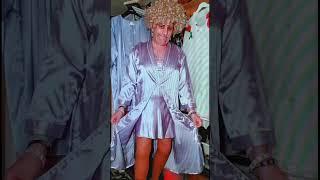 Wendy wearing a purple satin negligee?with brown stocking