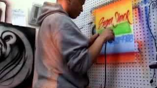 SugaRay paints Sugar Shack sign