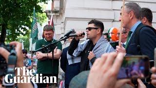 Crowds greet Kneecap rapper facing terrorism charge outside court