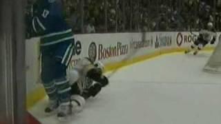 Raffi Torres runs over Tomas Kaberle