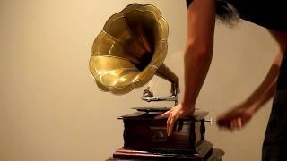 Playing the His Master's Voice hand crank gramophone.