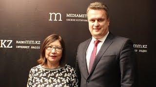 Сергей Назаренко, управляющий директор по программе модернизации "Казахтелеком"  и Аида Досаева