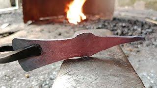 The blacksmith made khurpi from a piece of iron by hitting it with a hammer