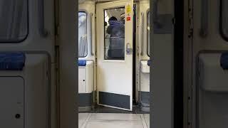 Walking through a train door on jubilee line