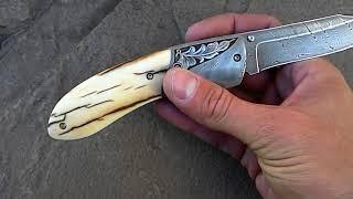 Hand made damascus folding knife