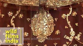 Heavy embroided bridal saree on display at a shop in Varanasi
