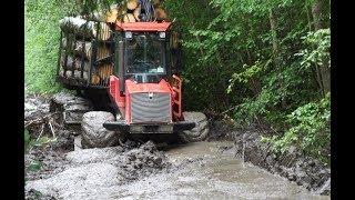 Valmet 840.3 logging in rainy summer forest, big load