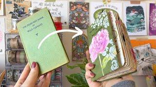 I turned an old book into an art journal!  Altered book flip through