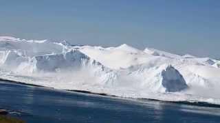 Ilulissat Icefjord - iceberg turning over.