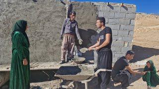 Cement work around the house of Ismat by Hossein and Yasin"