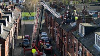 MALE ON ROOF ‘SLINGING TILES’ AS EMERGENCY SERVICES RUSH TO SCENE