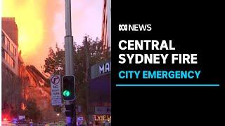 Sydney building fire causes chaos, flaming rubble thrown into street | ABC News