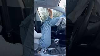 Jean and feet  with car