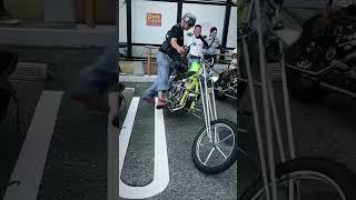 Biker guy with a cool chopper motorcycle but some interesting boots 