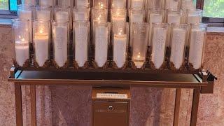 Lighting A Prayer Candle  At Sacred Heart Catholic Church