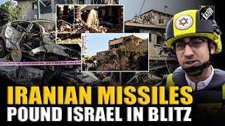 Rescue workers search damaged buildings, diggers move rubble in Haifa, Tel Aviv after Iran strike