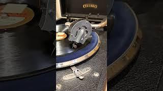 Portable gramophone, playing