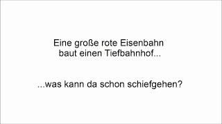 Eine große rote Eisenbahn baut einen Tiefbahnhof