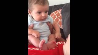 Gently blowing on baby's face results in priceless response