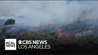 Firefighters continue to battle 3,600-acre brushfire near the Grapevine