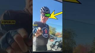 Cyclist vs Biker in Road Rage Showdown #shorts