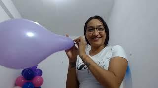 Girl blow to pop purple balloon