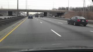 Driving Highway QEW east from Mississauga to WestMall, CANADA- highways