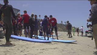 Young shark attack survivor inspires thousands at Switchfoot Bro-Am beach fest