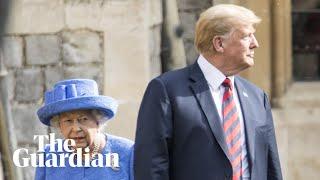 The Queen shows Donald Trump where to walk during the inspection of the guard at Windsor Castle