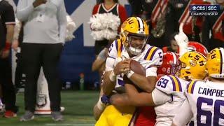 Georgia DL Jalen Carter holds LSU QB in the air while celebrating sack