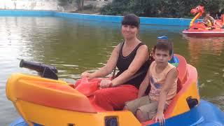 Riding the boats in the lake of Peremogy Park (Victory Park/Дендропарк_Перемоги) in Odesa Ukraine