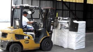 Cotton being loaded into a container