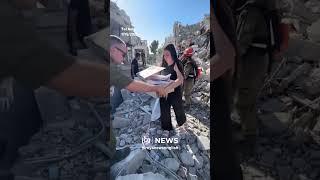 People inspect damage in Tel Aviv after Iranian missile strikes
