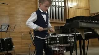 9 years old boy drummer Lyonya Shilovsky plays snare drum like an adult