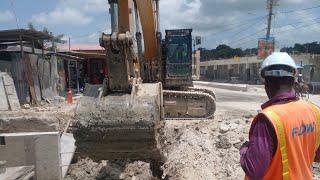 Close Up On Excavator Scoop Digging Drainage] Cotton Tree Port Morant St Thomas.