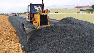 Bulldozer Spreading Gravel Building Foundation New Big Road And Dump Truck Unloading Gravel ...