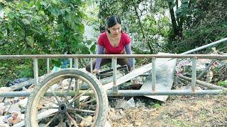 The girl repair, restore an old broken 3-wheeled vehicle to its original state 