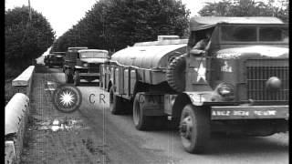 U.S. Army "Red Ball" Convoy passes through  village of Courville sur eure, France...HD Stock Footage