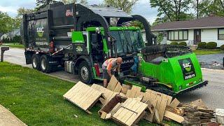SBC Waste Front Loader Garbage Trucks Packing Bulk at the Spring Cleanup