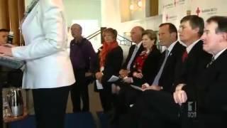 Gillard makes dig at 'cross' Abbott