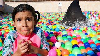 Ellie & Charlotte Ball Pit Shark Surprise in the Swimming Pool