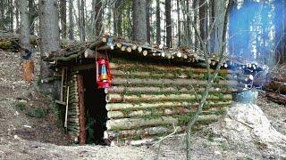 Construction of a warm shelter with a fireplace inside. Stayed overnight in a survival shelter