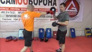 Basic punches. Training on boxing paws. Street hand-to-hand combat MMA