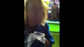 Woman in carnivals swallows fish whole