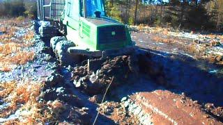 Powerful John Deere 1110D in mud