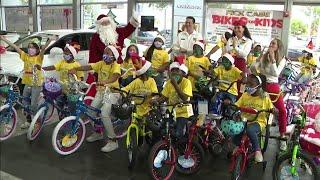 Rick Case holds annual holiday season children's bike giveaway