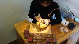 The process of making stamps by hand-engraving by a couple. A stamp workshop with 77years history.