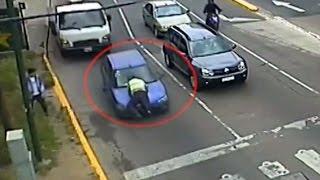 Woman drives over 300m with traffic inspector on bonnet of her car