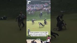 Climate protesters run onto 18th green and spray powder at PGA Tour event in Connecticut