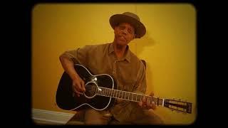 "Going Down The Road" performed by Eric Bibb